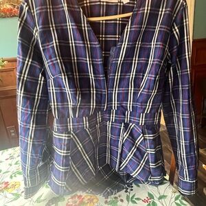 Plaid top with fitted waist.